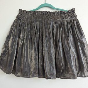 Silver shimmering metallic ruffled mini skirt stretching